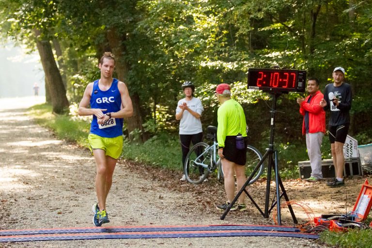 a male GRC finisher at the National Capital 20 Miler in a time of two hours ten minutes and thirty-seven seconds